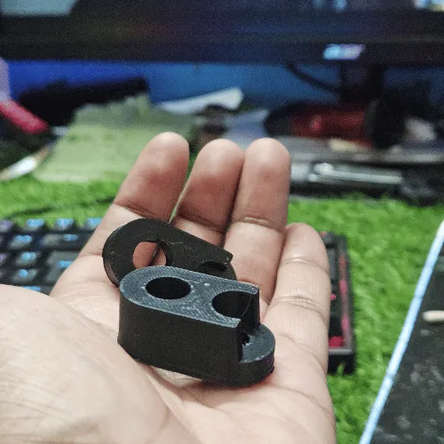 Customer Saikat holding the black MotoNyx indicator adapter