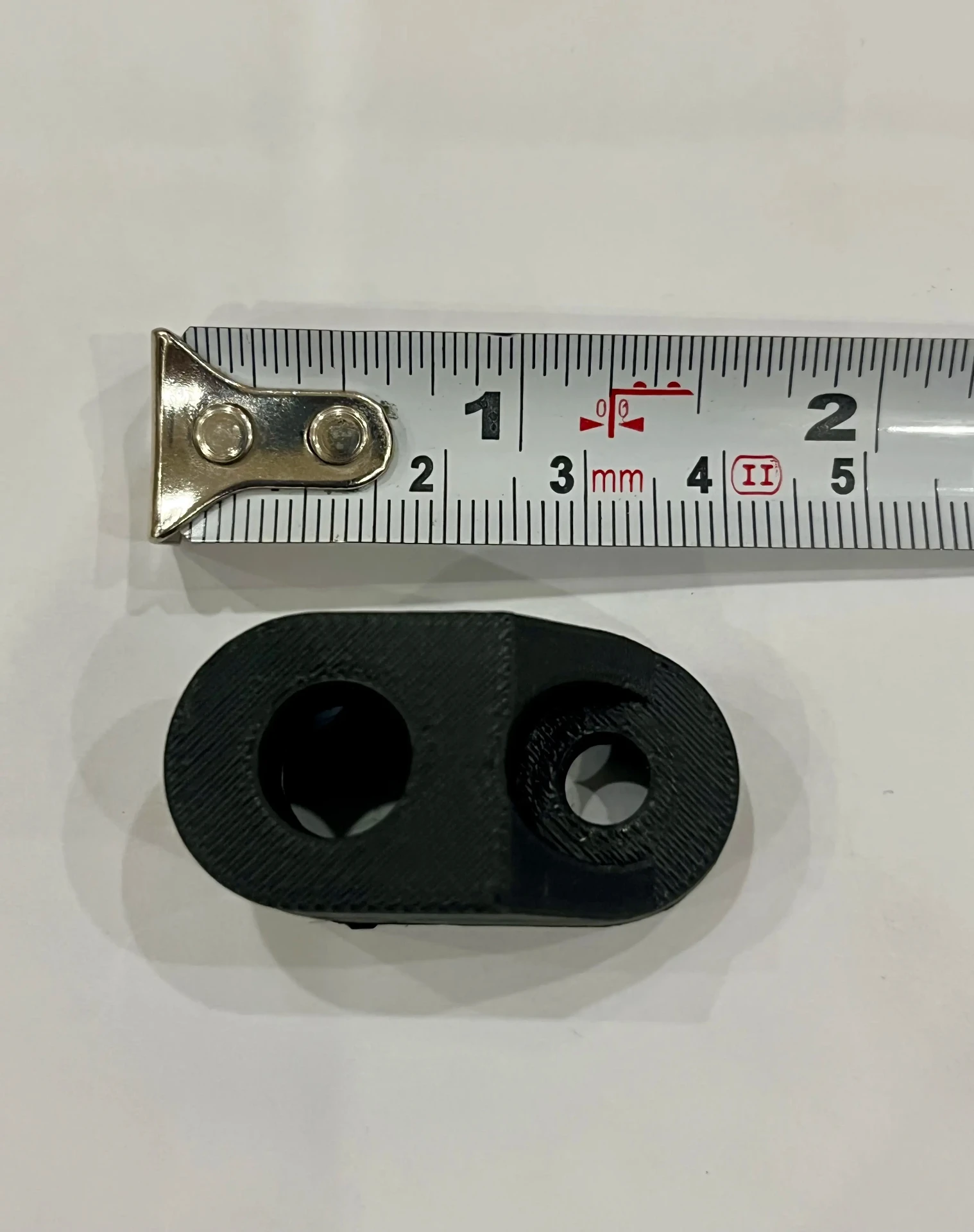 MotoNyx indicator adapter measured against a tape measure