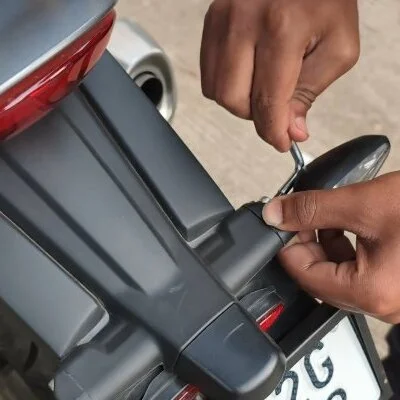 Unscrewing the stock indicator from a Triumph 400